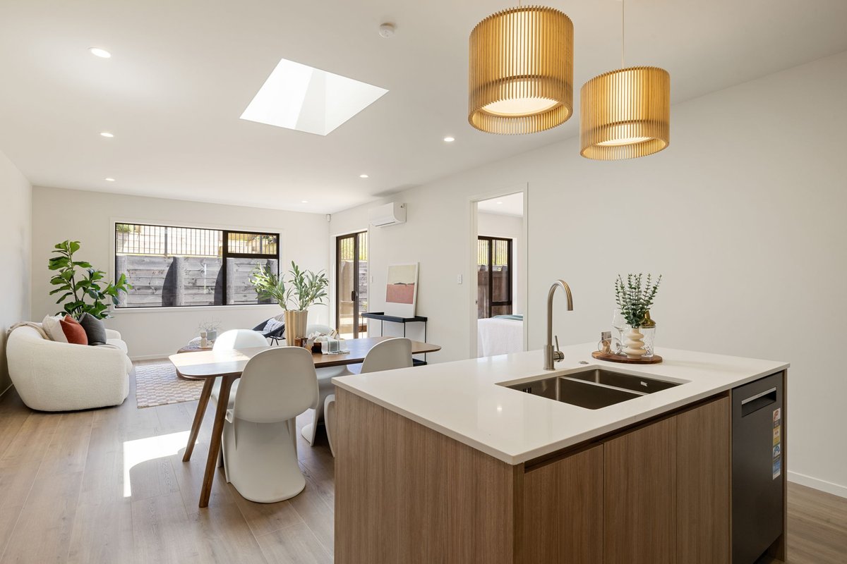 New home interior — open plan kitchen and living by Generation Projects